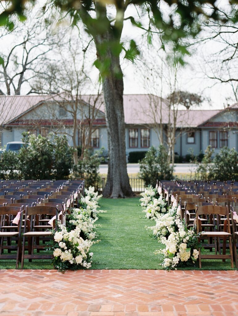 White floral arrangements for outdoor wedding ceremony. | Austin Wedding Floral Designer | Reiley + Rose