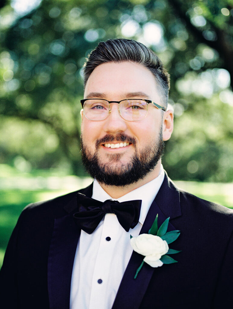 groom with boutonierre  | Chandelier of Gruene Wedding | Modern Black and White Chic Wedding | 