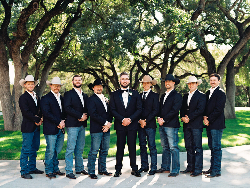 groom and his guys in cowboy hats  | Chandelier of Gruene Wedding | Modern Black and White Chic Wedding | 