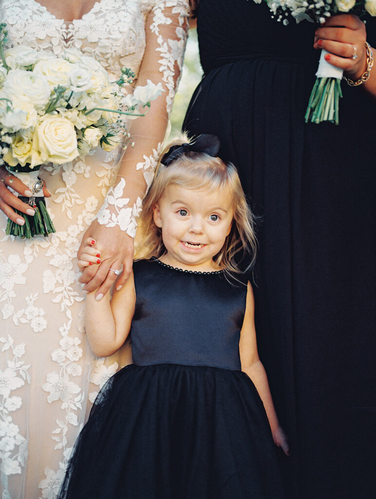 flowergirl smiling  | Chandelier of Gruene Wedding | Modern Black and White Chic Wedding | 