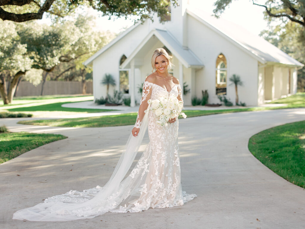 bride in front of chapel  | Chandelier of Gruene Wedding | Modern Black and White Chic Wedding | 