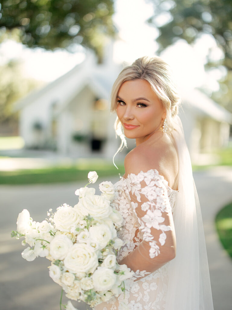 bride with bridal bouquet  | Chandelier of Gruene Wedding | Modern Black and White Chic Wedding | 