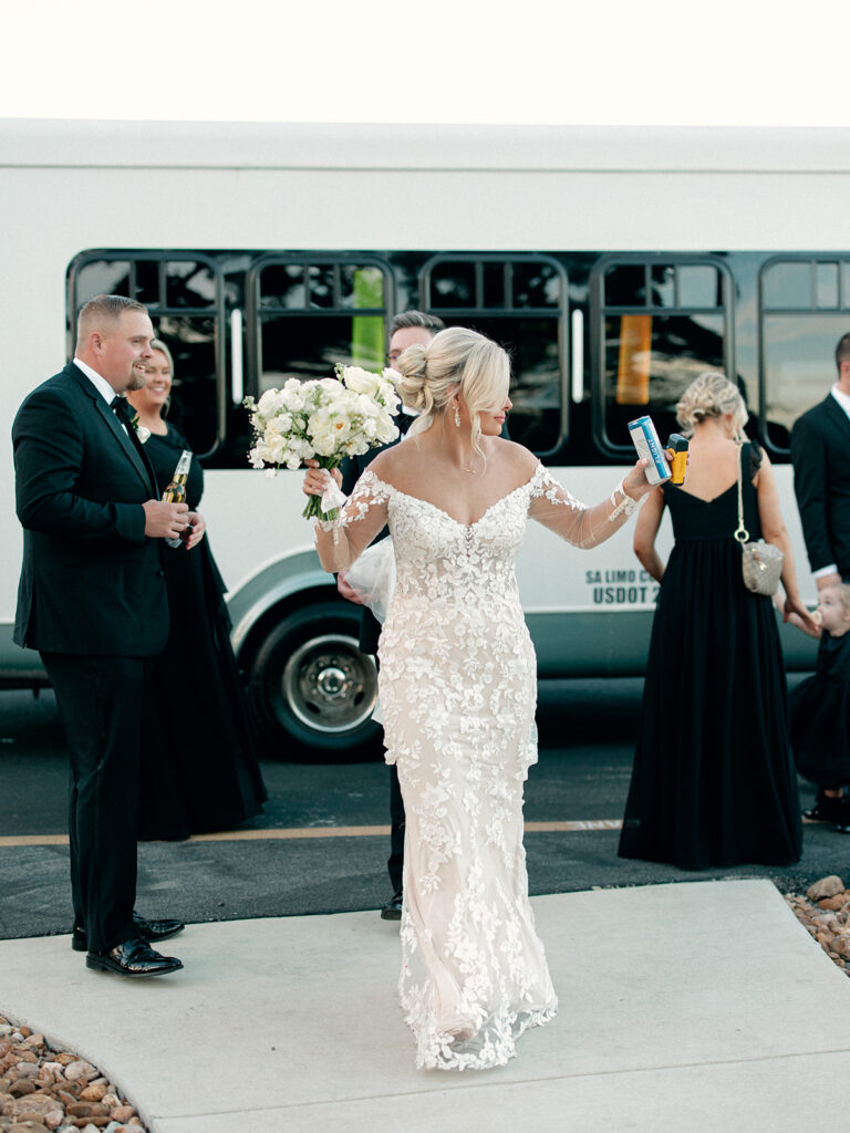 bride leaving party limo  | Chandelier of Gruene Wedding | Modern Black and White Chic Wedding | 