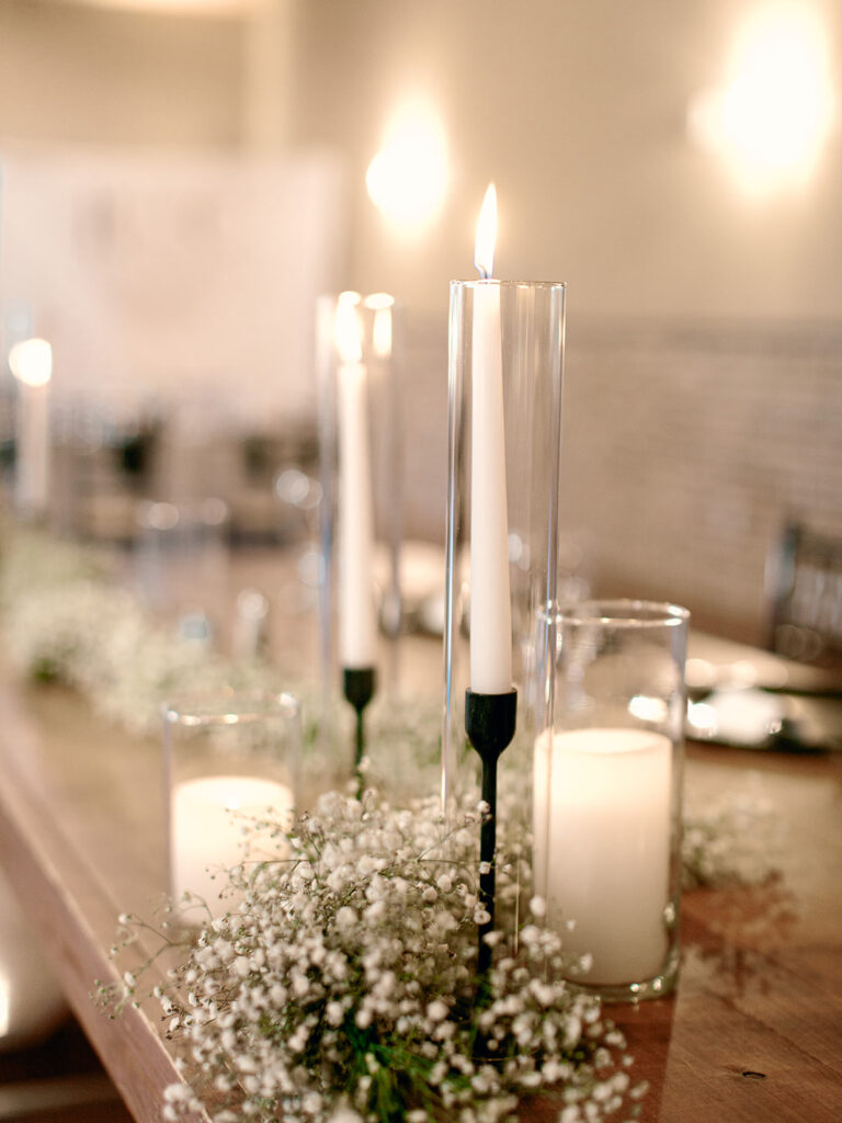 taper candle with babies breath | Chandelier of Gruene Wedding | Modern Black and White Chic Wedding | 