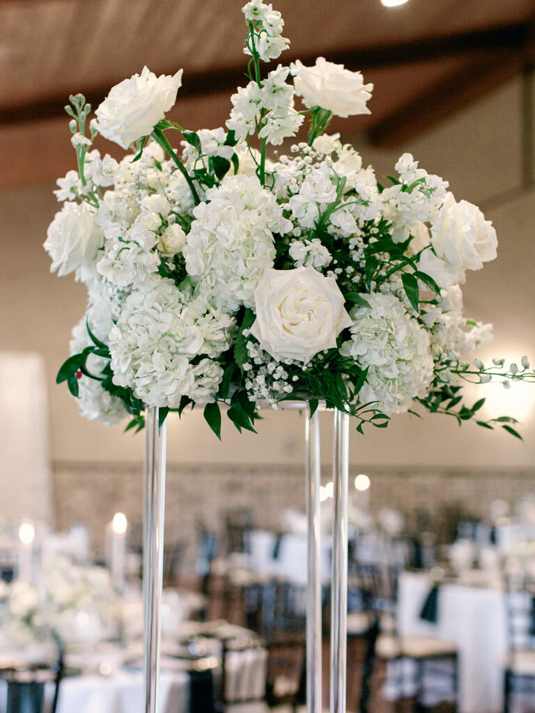 tall floral arrangement | Chandelier of Gruene Wedding | Modern Black and White Chic Wedding | 