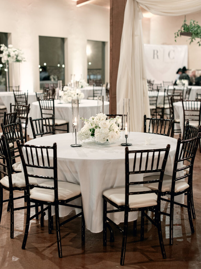 round table centerpiece | Chandelier of Gruene Wedding | Modern Black and White Chic Wedding | 
