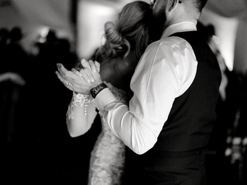 bride and groom dancing  | Chandelier of Gruene Wedding | Modern Black and White Chic Wedding | 