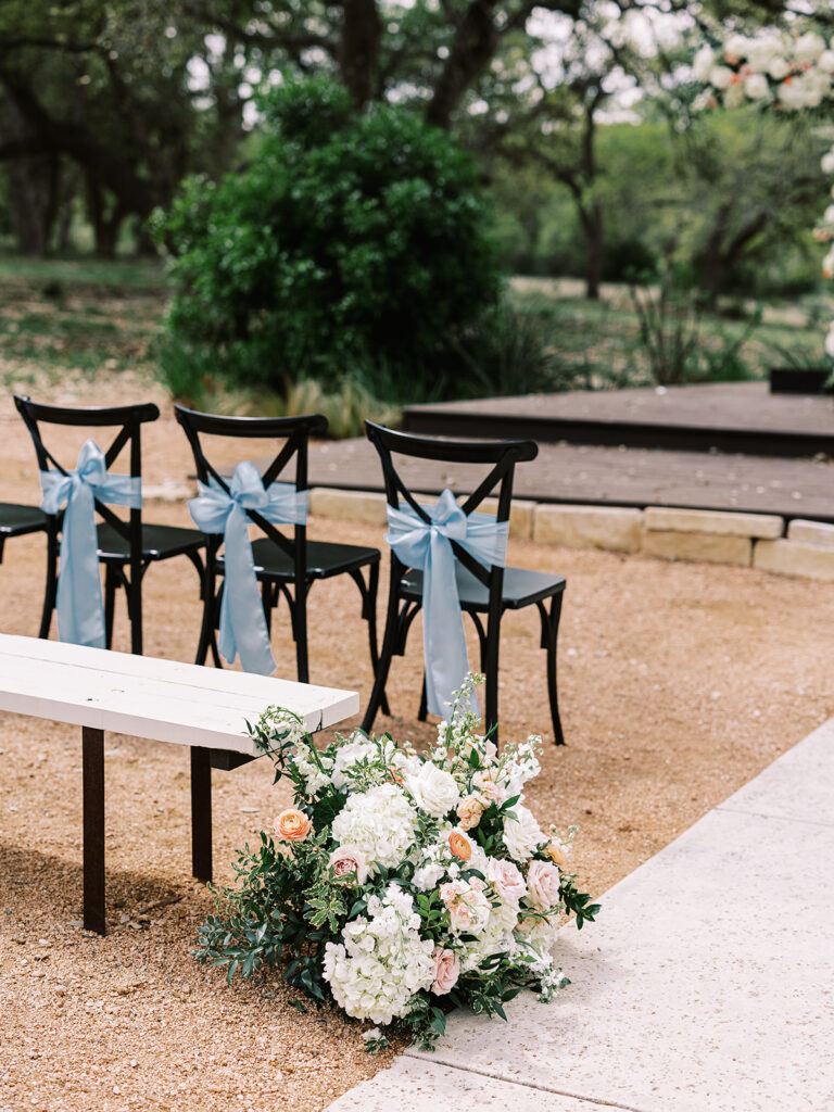 blue satin bows on chairs