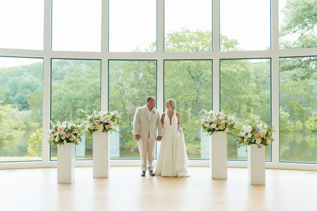 bride and groom shot with flowers at altar at the preserve at canyon lake
