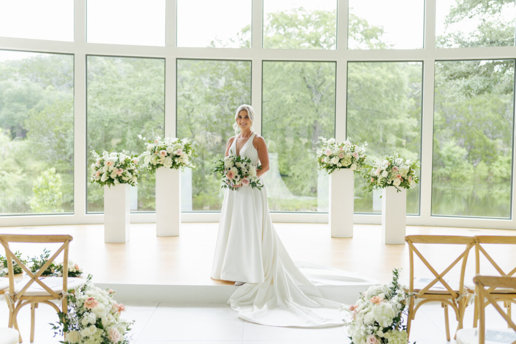 bride standing at altar with flowers
wedding planner