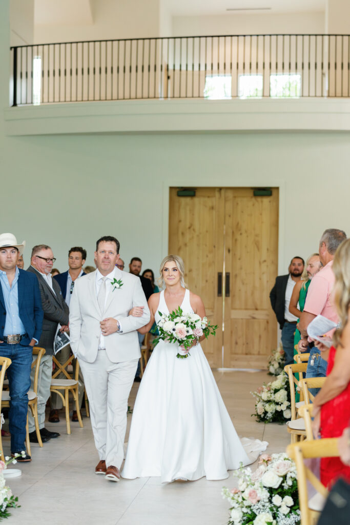 father of the bride walking bride down the aisle