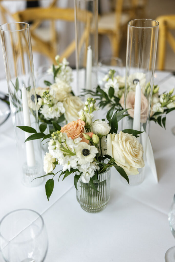 taper candles and flower centerpieces why you need to hire a wedding planner