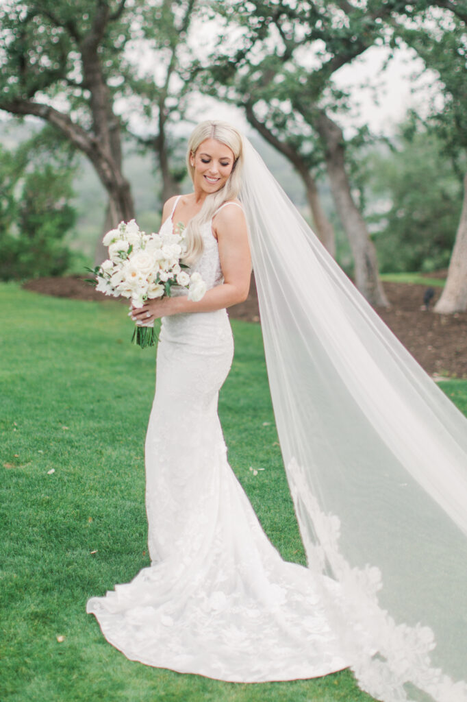 bridal portrait all white wedding flowers
