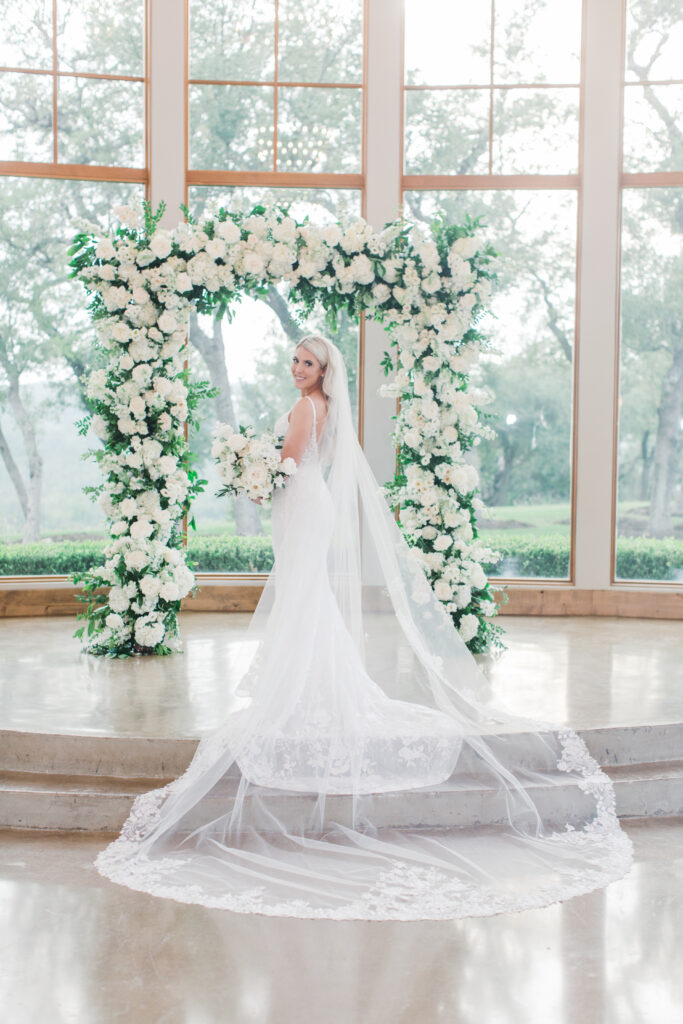 bride and wedding arch in chapel
floral filled wedding