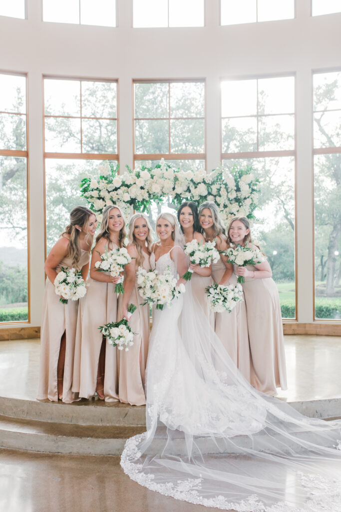 bridesmaids champagne dresses white florals
floral filled wedding