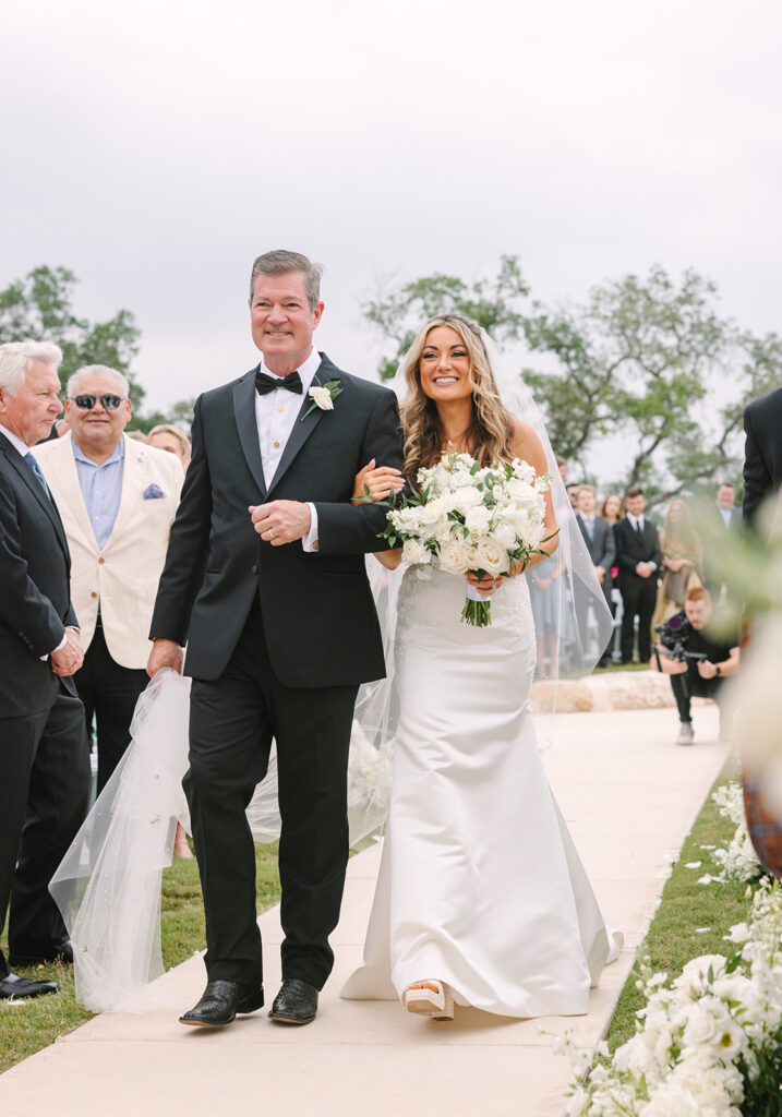 bride and dad walking down the aisle Spring Hill Country Wedding Day
Hill Country Wedding Day