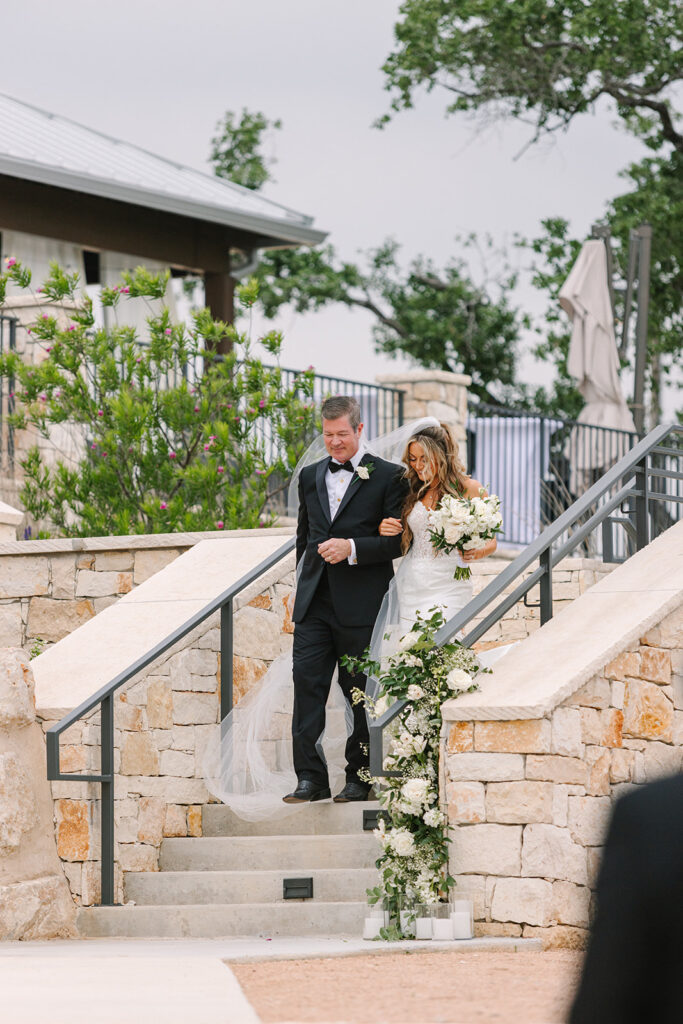 bride and dad walking down the aisle