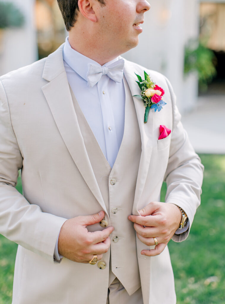 broom suit with boutionerre spring wedding florals
