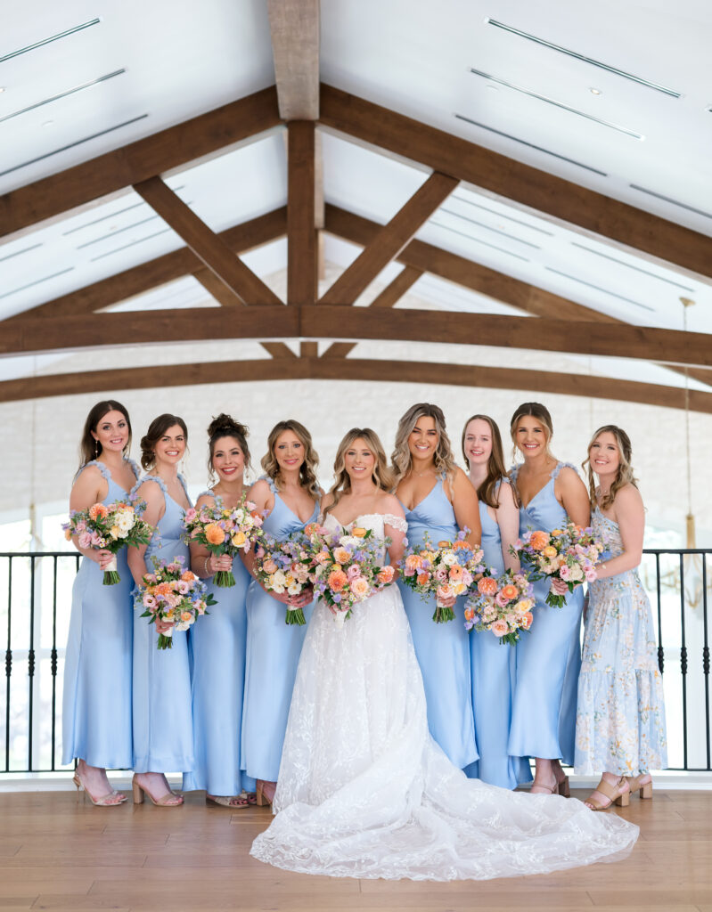 Bridesmaids laughing and holding pastel bouquets with peach, lavender, and blush blooms.
The Preserve at Canyon Lake wedding
