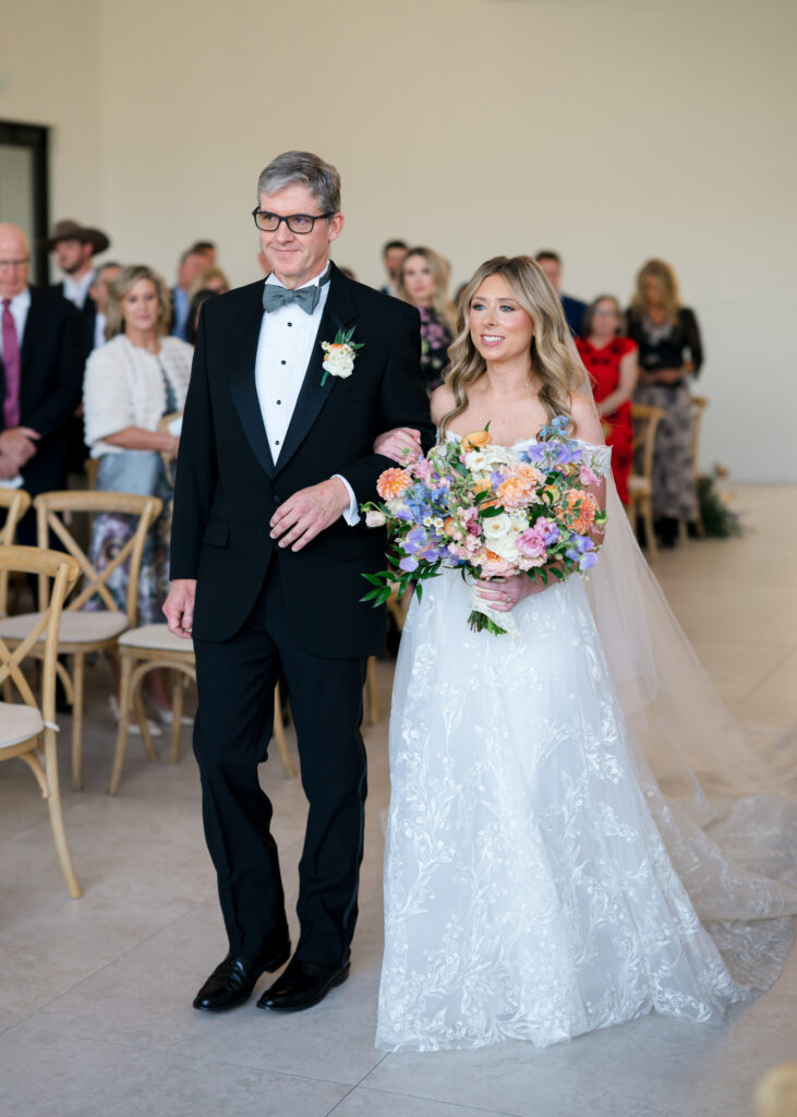 Lush bridal bouquet with peach, lavender, and blush blooms

The Preserve at Canyon Lake wedding