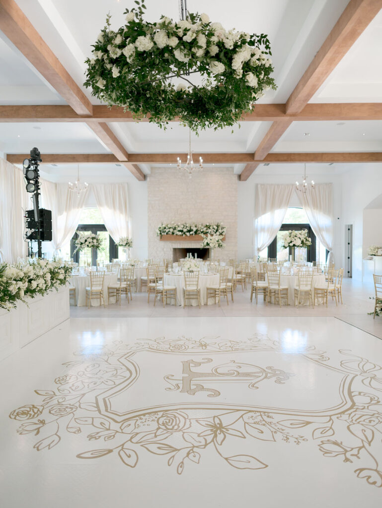 Hanging wedding day flowers above the dance floor is the best way to elevate a room