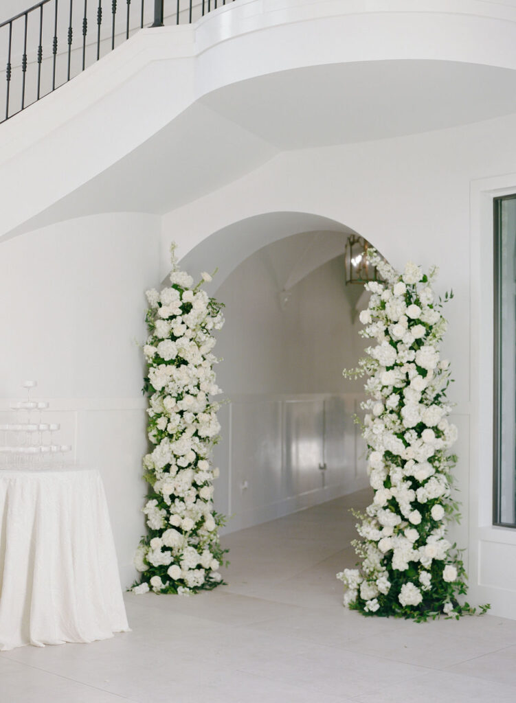 Repurposed ceremony florals were the perfect addition to the hallway space