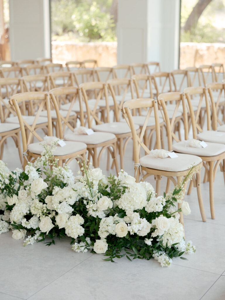 This grounded white floral design was perfect for the aisle