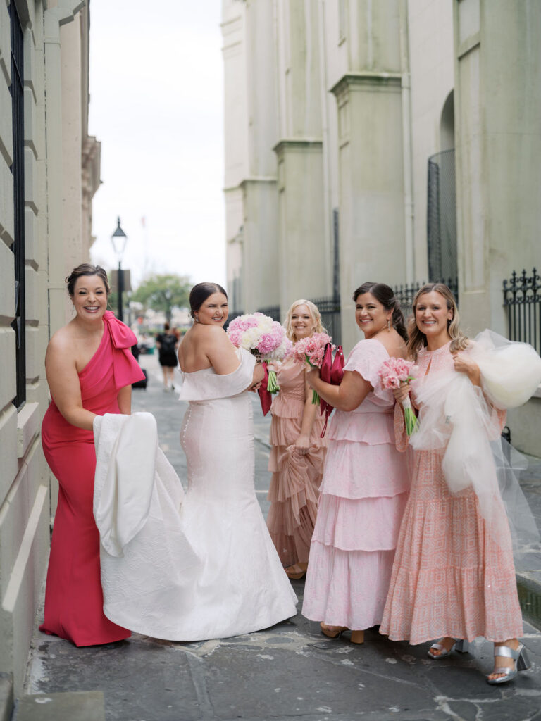 Bridal party in downtown New Orleans with their wedding flowers and bouquets