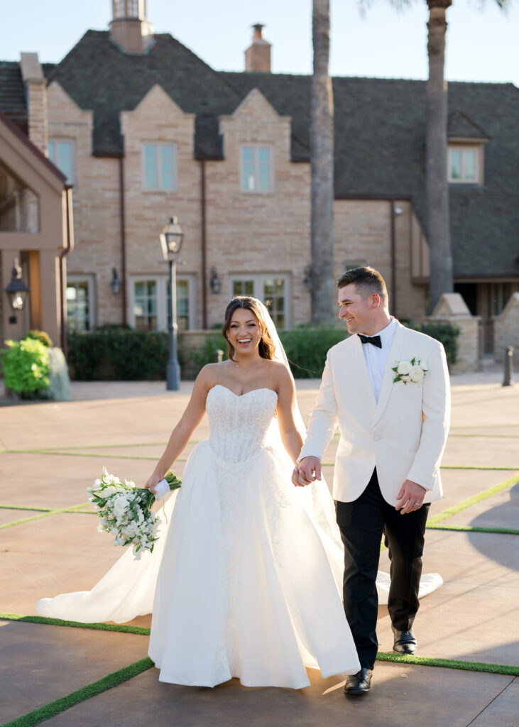 Happy newlyweds who had an appropriate wedding floral budget