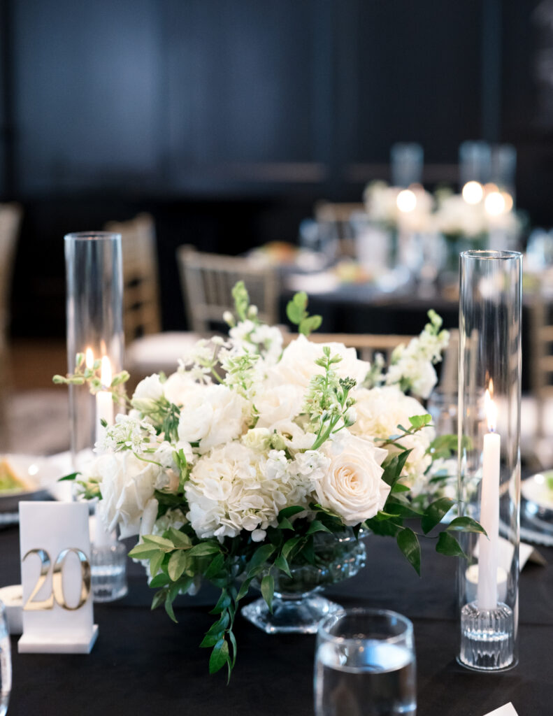 White wedding floral centerpiece in glass compote