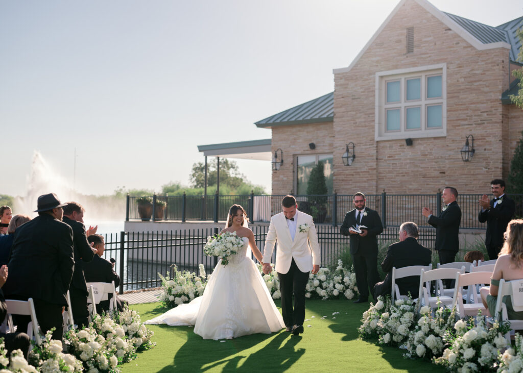 White ceremony flowers look stunning thanks to planning a proper wedding floral budget