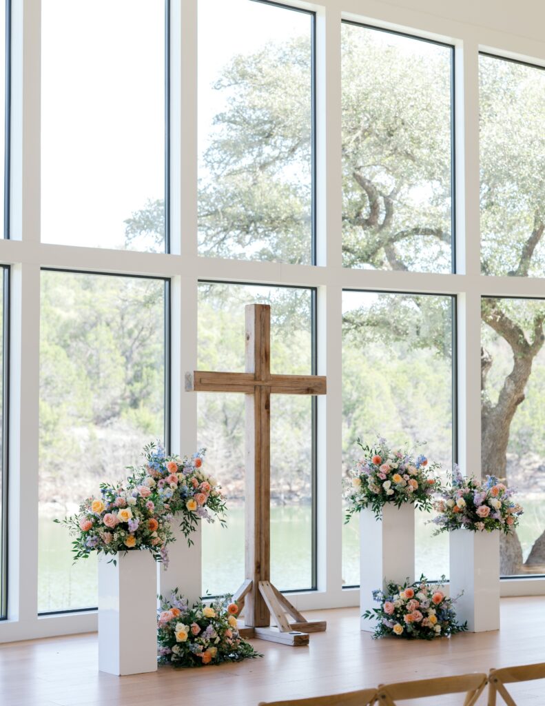 Floral pillars with wooden cross