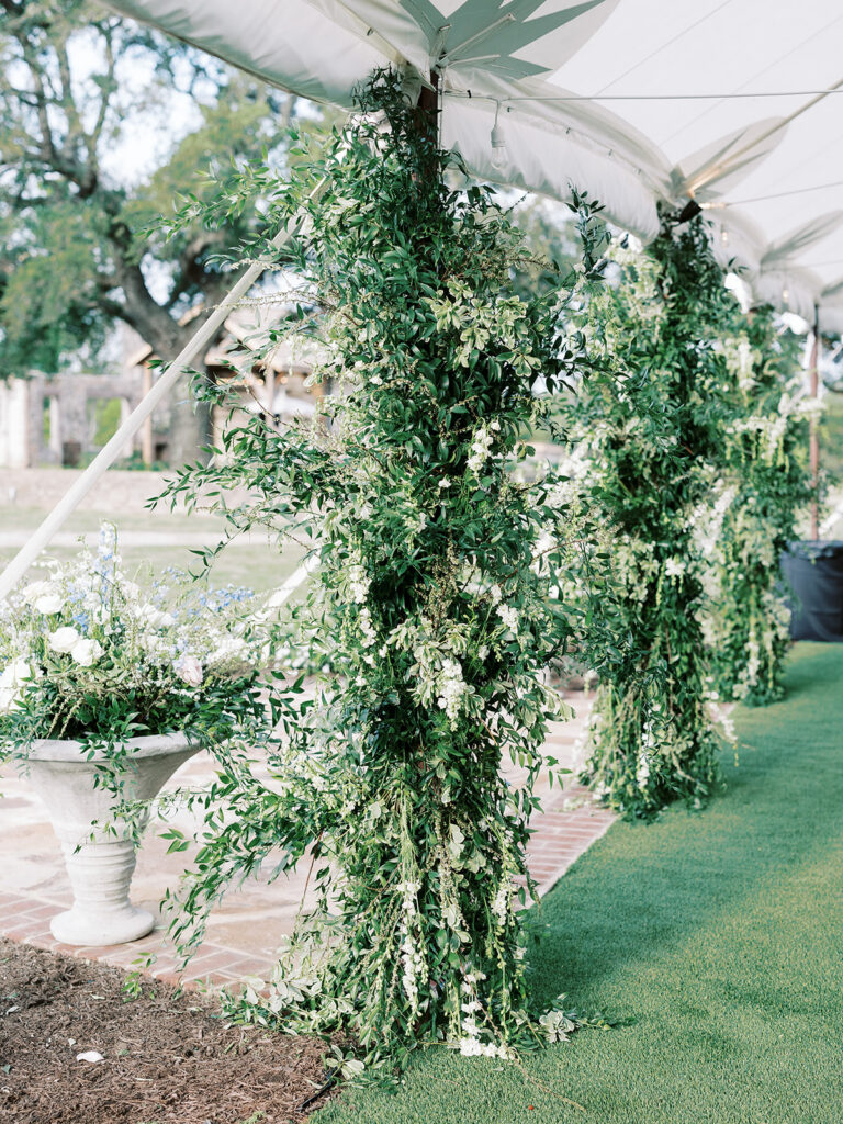 Greenery tent pole installation
